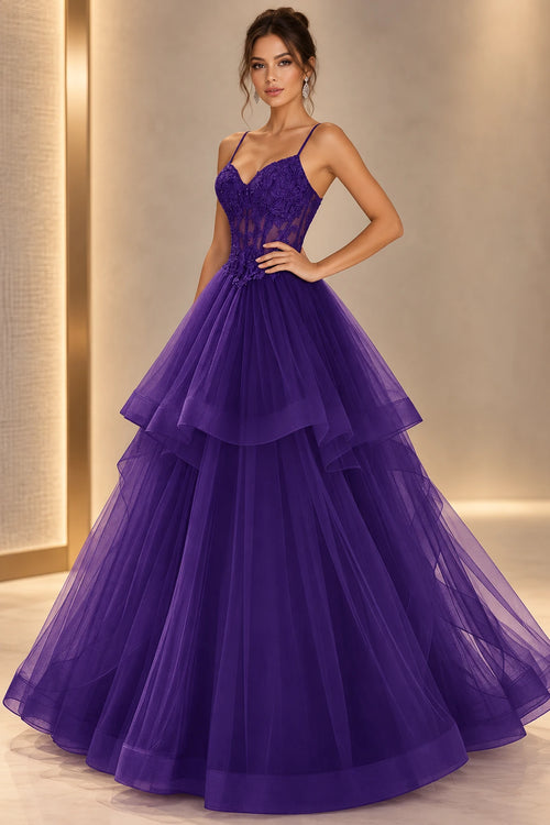 Purple A line prom dress with sweetheart neckline, thin straps, sheer floral corset-style bodice, and a layered floor-length skirt.