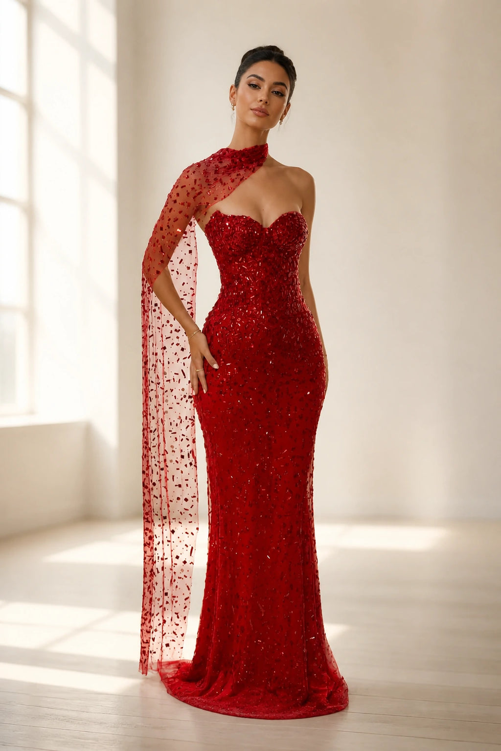 GraceProm red sequin prom dress with sweetheart neckline sheer cape detail and fitted floor length silhouette