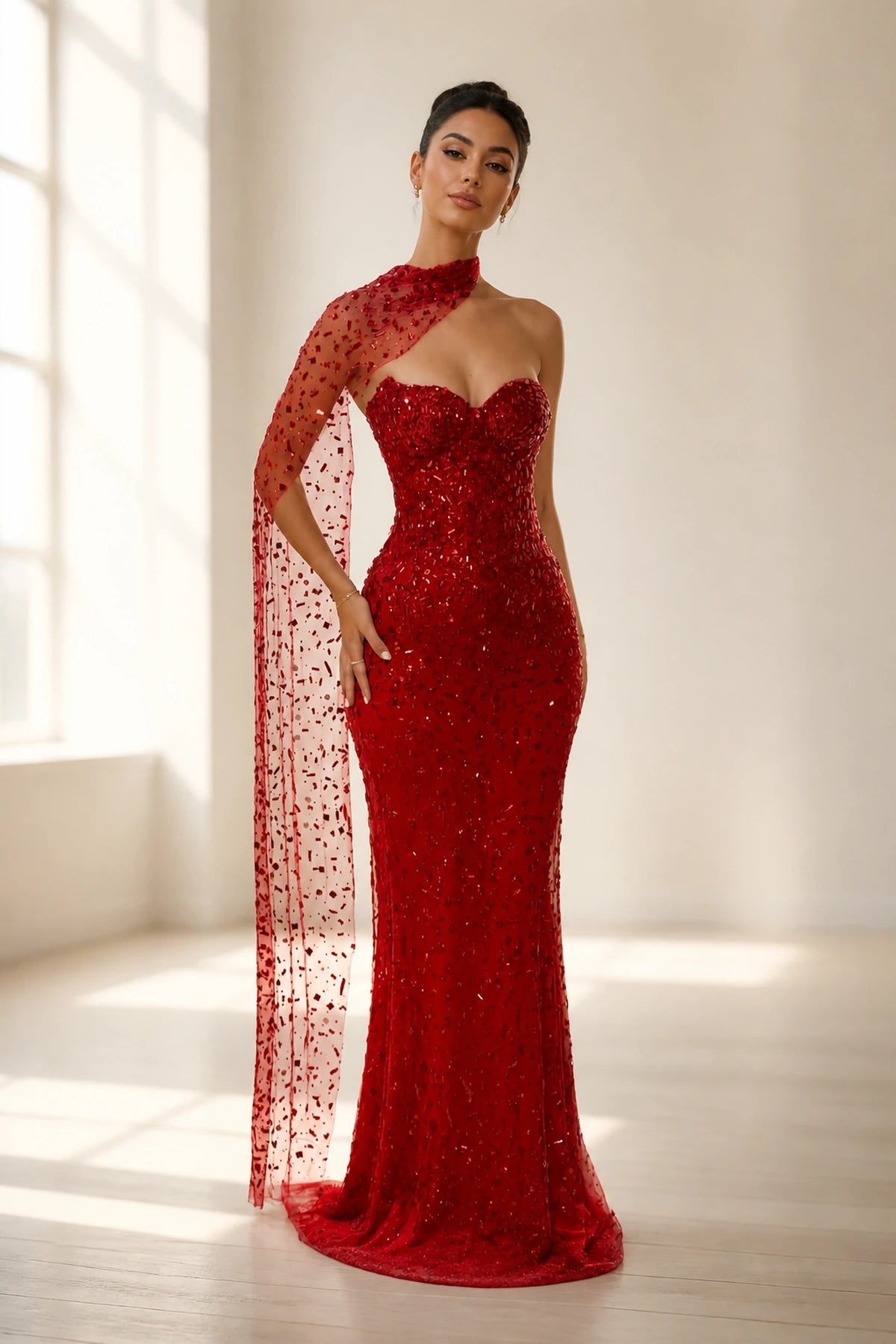 GraceProm red sequin prom dress with sweetheart neckline sheer cape detail and fitted floor length silhouette