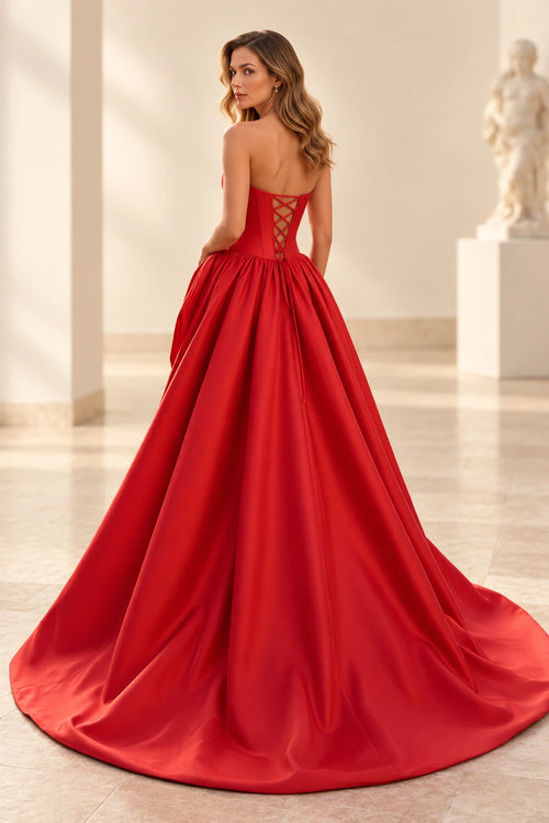 Back view of red satin A-line prom dress featuring adjustable lace-up corset back and full floor-length gathered skirt