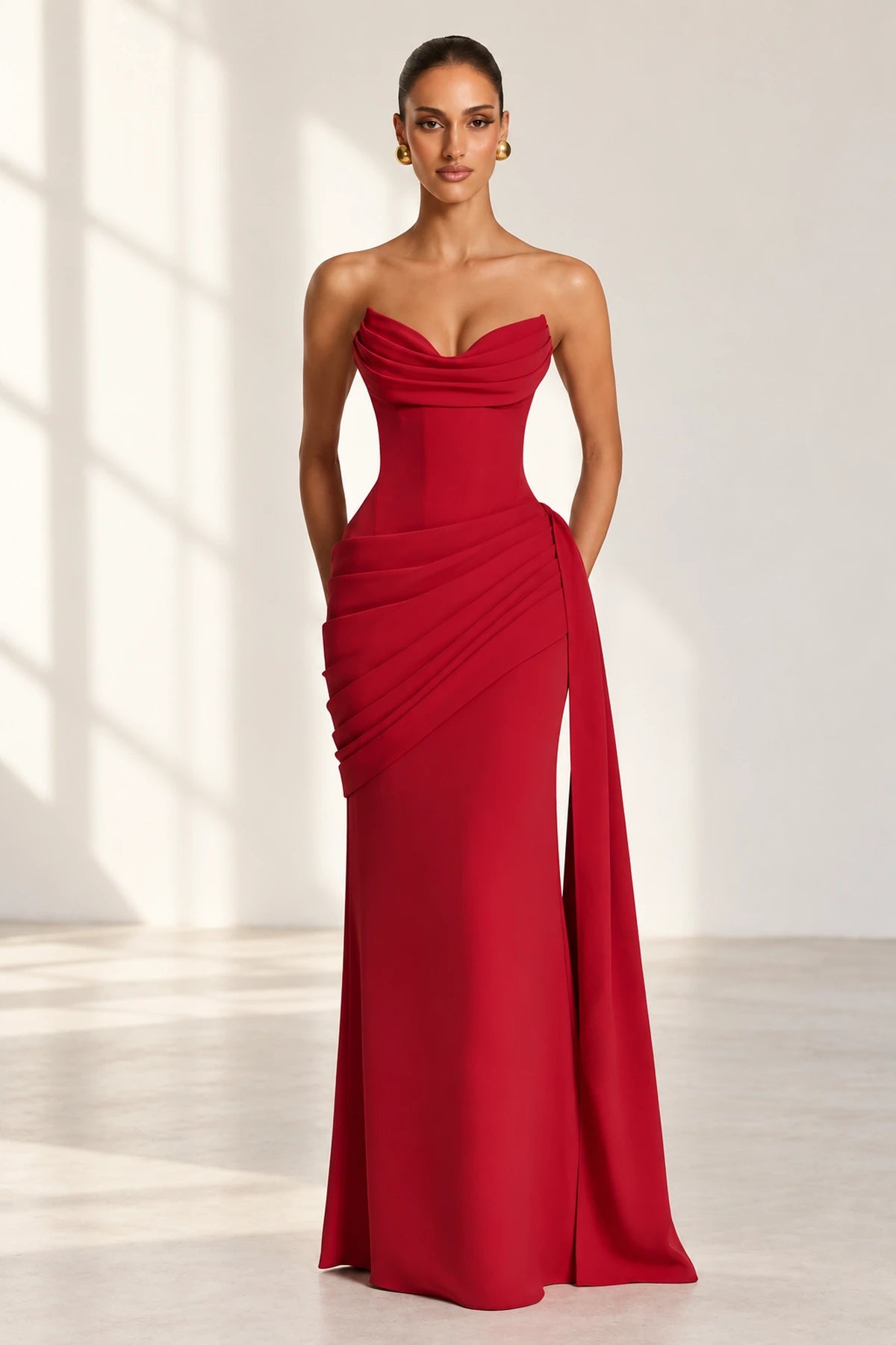 Red strapless sweetheart floor length wedding guest dress with draped waist front view