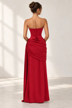 Red lace up back floor length wedding guest dress with draped skirt back view