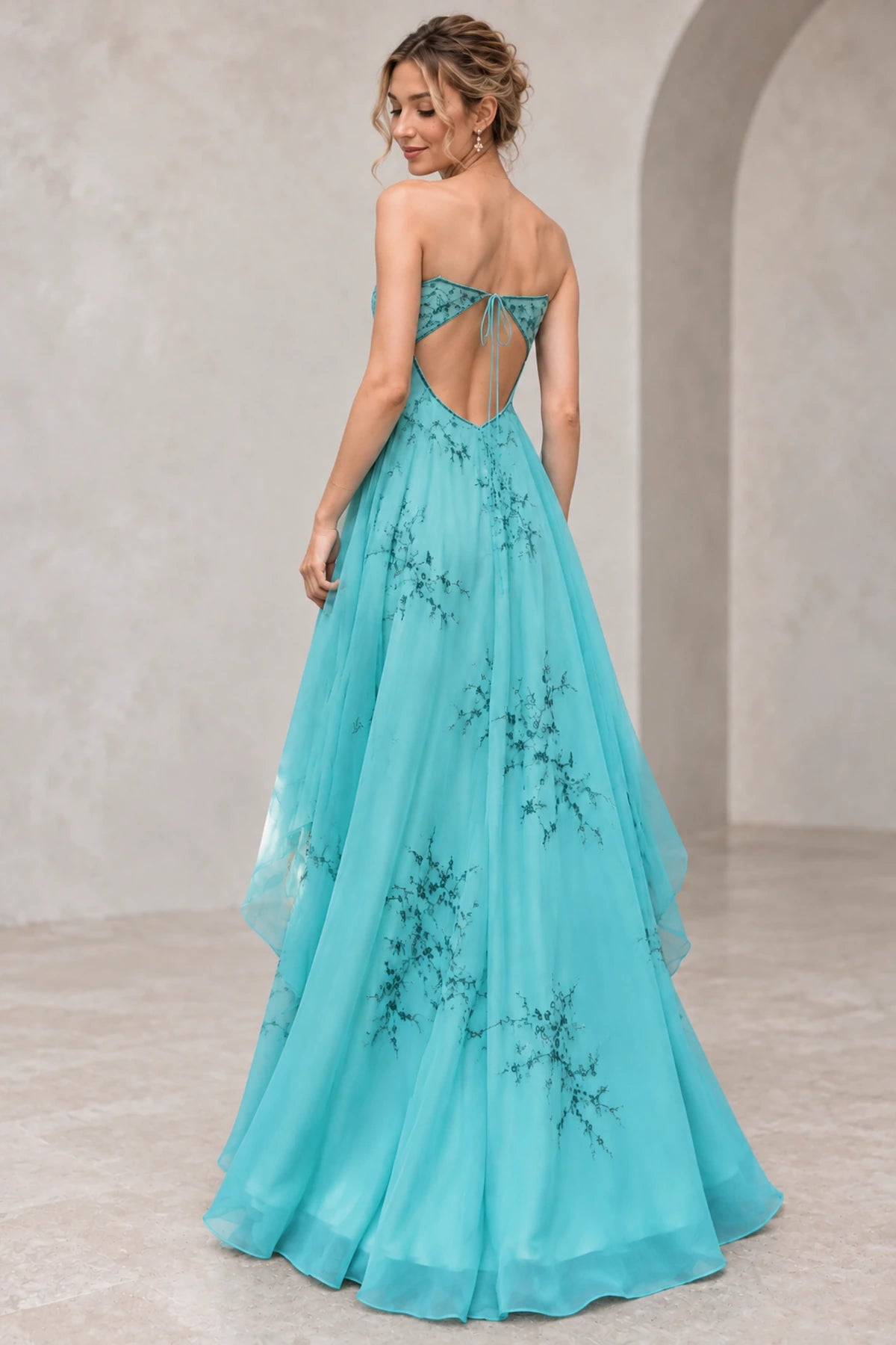 Graceprom chiffon prom gown with open tie-back design, embroidered bodice, flowing A-line skirt, and floor-length hem, back view