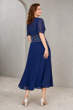Royal blue A-line Mother of the Bride dress with square neckline, geometric beaded bodice, chiffon shrug and tea-length skirt, front and back view by Vedress