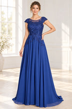 Royal blue lace wedding guest dress with illusion neckline cap sleeves and A line floor length skirt