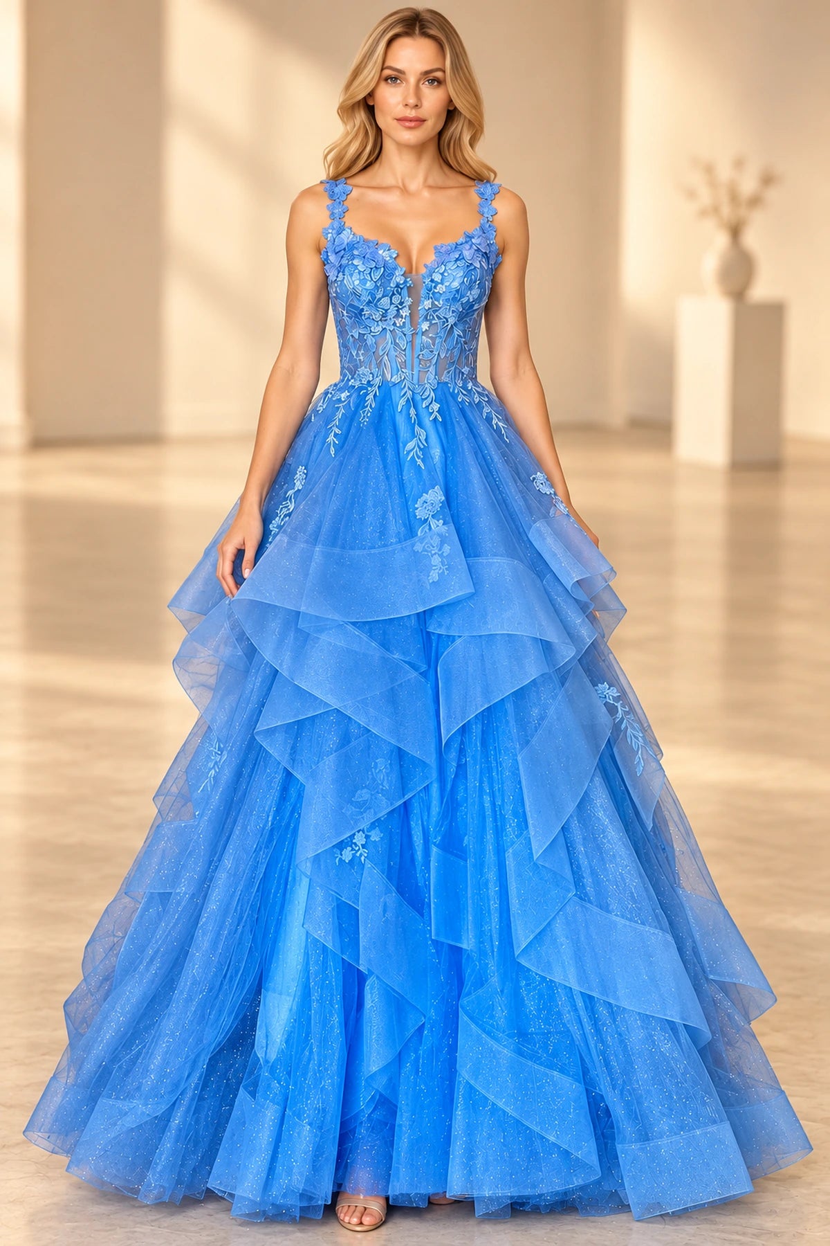 Royal blue ball gown prom dress with a plunging V-neckline, floral lace straps, sheer corset bodice, and cascading glitter tulle ruffles by Graceprom.