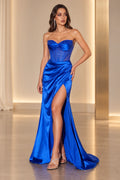 Angled front view of Graceprom royal blue satin prom dress with a beaded sweetheart neckline, sheer corset bodice and thigh-high slit.
