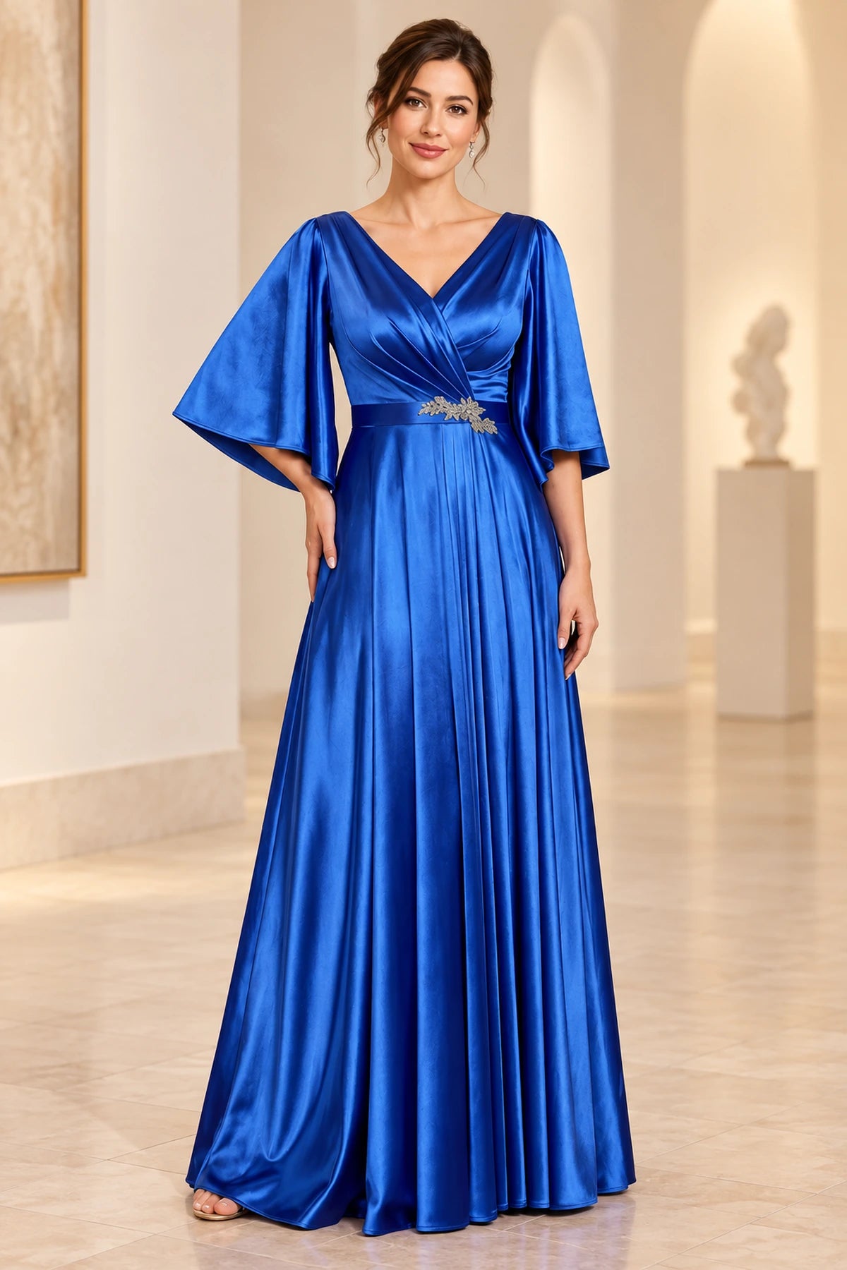 Royal blue mother of the bride dress with V-neck, flutter sleeves, pleated waist and floor-length A-line skirt