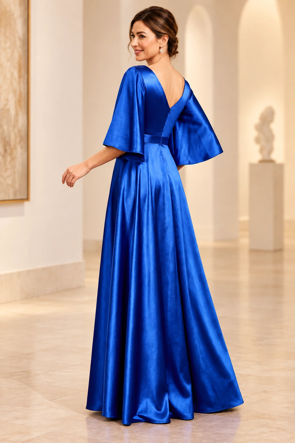 Back view of royal blue mother of the bride dress with V-back, flutter sleeves and floor-length A-line skirt