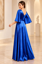 Back view of royal blue mother of the bride dress with V-back, flutter sleeves and floor-length A-line skirt