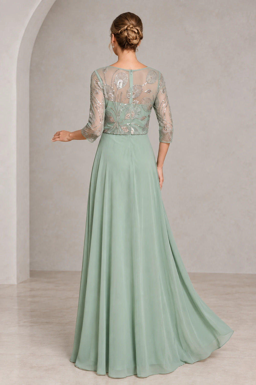 Back view of sage green mother of the bride dress with sheer beaded illusion back three-quarter sleeves center zipper and flowing A-line skirt