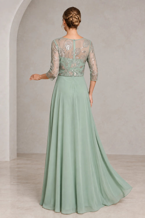 Back view of sage green mother of the bride dress with sheer beaded illusion back three-quarter sleeves center zipper and flowing A-line skirt