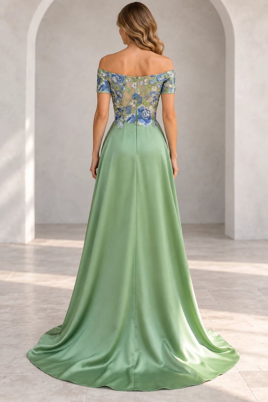 Back view of sage green Mother of the Bride Dress with floral embroidered bodice and flowing floor-length skirt