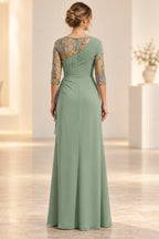 Back view of sage green Mother of the Bride Dress with sheer floral embroidery and draped bodice