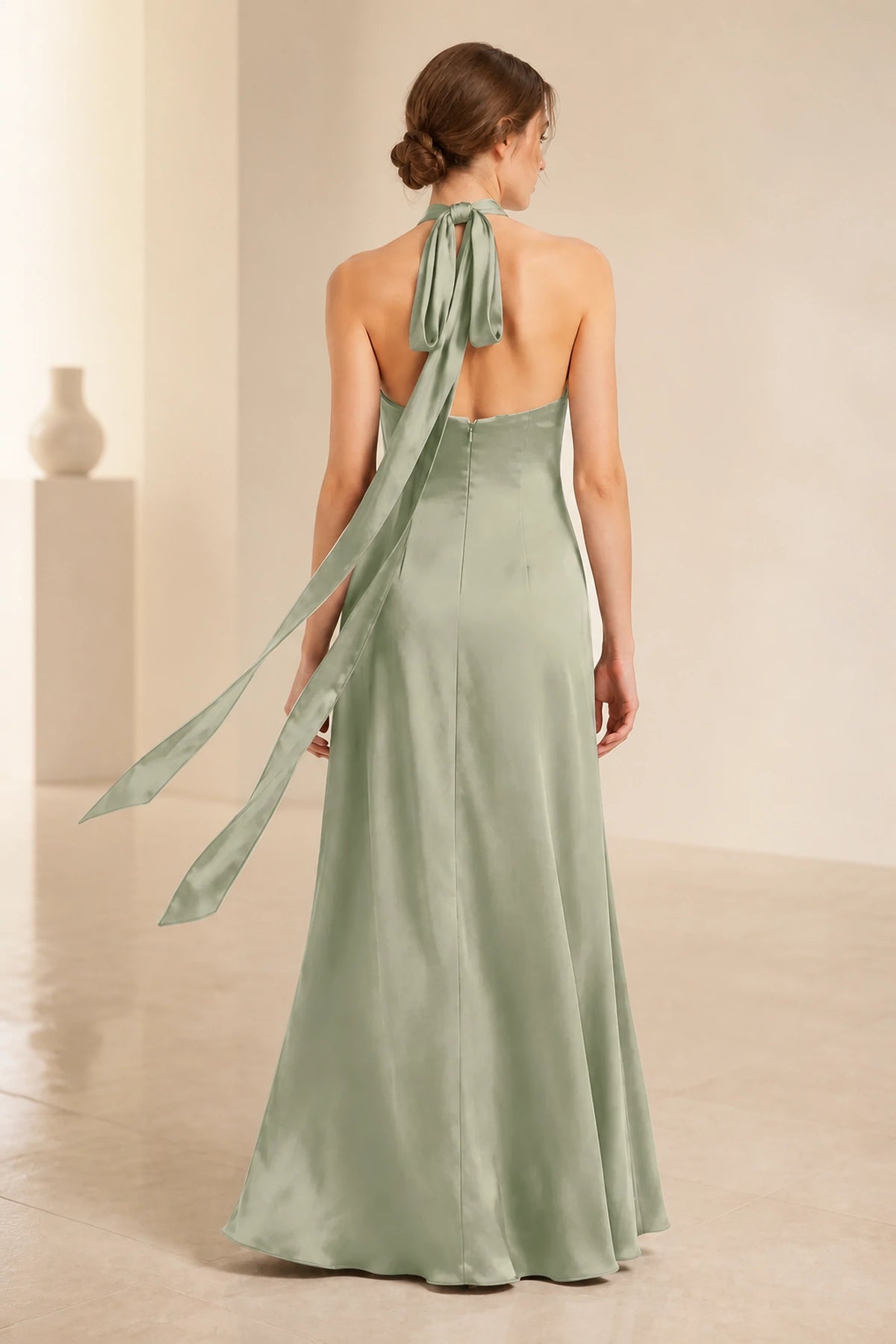 Sage green halter neck bridesmaid dress with keyhole front, tie back, side slit and floor-length A-line skirt, front and back view