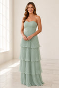 Sage green strapless bridesmaid dress with sweetheart neckline, ruched bodice and pleated tiered floor-length skirt