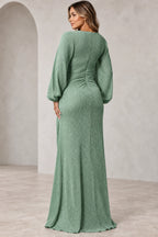 Back view of sage green Mother of the Bride Dress with long sleeves, gathered waist and flowing floor-length skirt