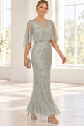 Sage silver mother of the bride dress with illusion neckline beaded cape sleeves and long sheath silhouette