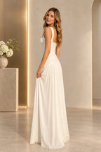 Back view of an ivory Graceprom prom dress with wide shoulder straps, a low curved neckline, center-back zipper and gathered chiffon skirt.