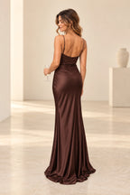 Back view of chocolate brown satin mermaid evening dress featuring spaghetti straps, low back, floral lace bodice, center zipper and flowing skirt