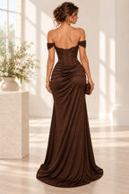 Back view of chocolate brown satin mermaid evening dress featuring off shoulder lace sleeves, sheer embroidered corset bodice, ruched hips and sweeping hem