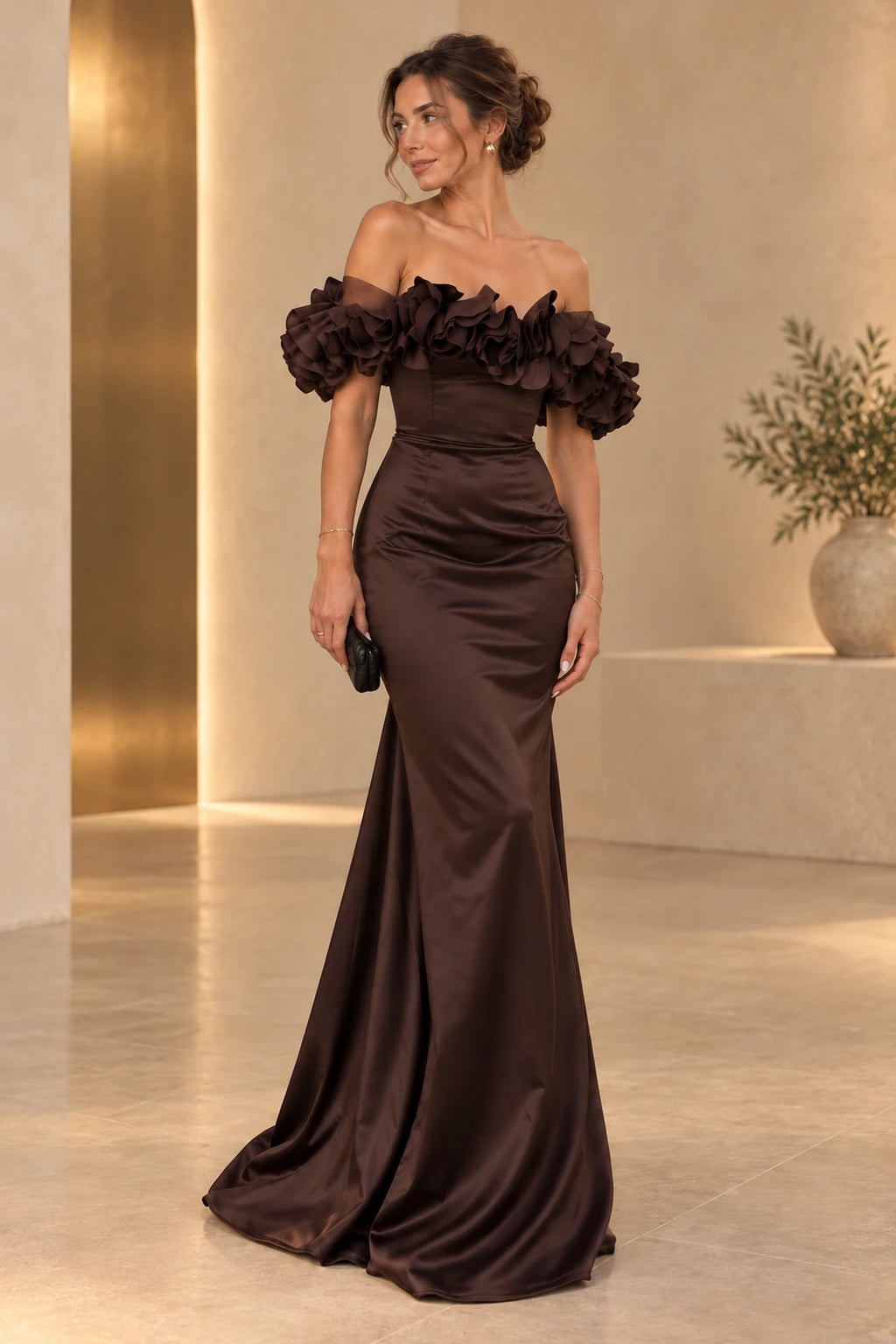 Chocolate brown satin mermaid evening dress with off shoulder layered ruffle sleeves, fitted bodice and flowing floor length skirt by Graceprom