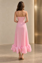 Back view of a pink Graceprom satin wedding guest dress with adjustable straps, a low straight back, center zipper and ankle-length ruffle skirt.