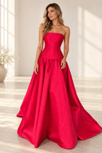 Red satin A-line prom dress with straight strapless neckline, structured corset-inspired bodice, fitted drop waist and voluminous floor-length skirt by Graceprom