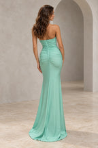 Back view of a mint green Graceprom satin evening dress with a low curved neckline, center-back zipper, ruched hips and floor-length flared skirt.