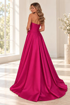 Back view of hot pink satin A-line prom dress featuring straight strapless back, center zipper, fitted waist and flowing full length skirt