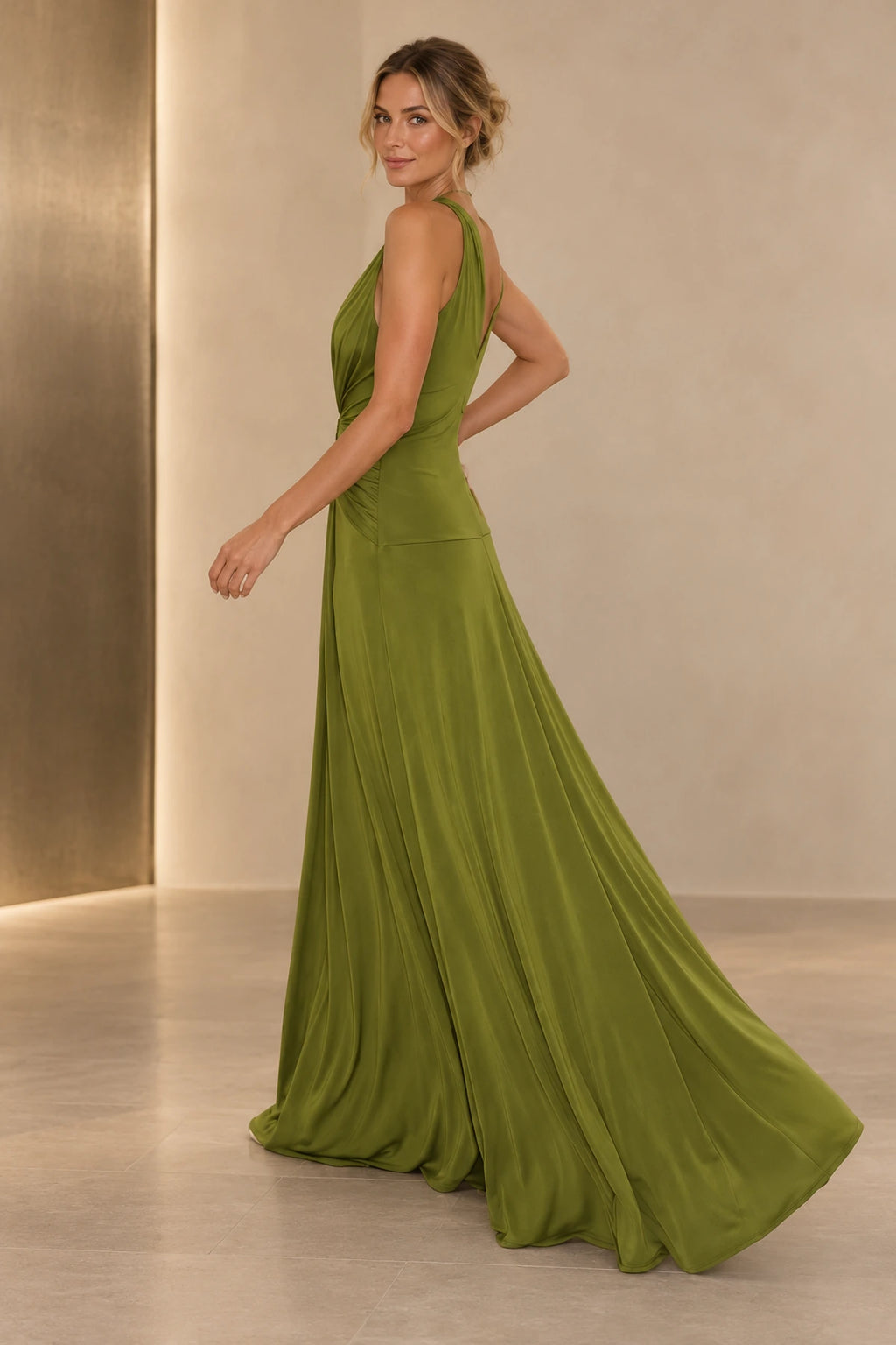Back view of an olive green Graceprom satin prom dress featuring a deep V-back, gathered waist, fitted hips and a softly trailing hem.