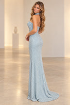 Rear three-quarter view of Graceprom light blue sequin evening dress with a low strapless back, fitted hips and a softly rounded sweep train.