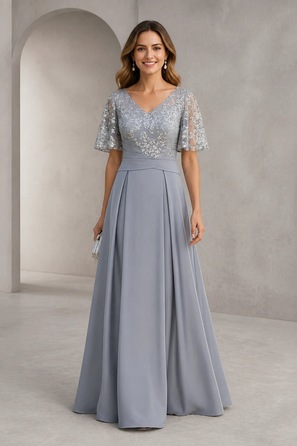 Silver gray A-line mother of the bride dress with V-neckline, lace bodice, flutter sleeves and floor-length skirt