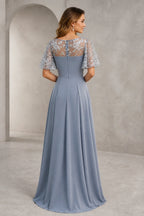 Back view of silver gray mother of the bride dress with sheer lace back, flutter sleeves, center zipper and A-line skirt