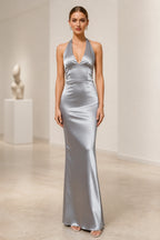 Silver satin wedding guest dress with halter V-neckline, sleeveless fitted sheath silhouette and floor-length skirt
