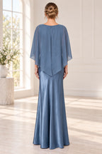 Back view of slate blue mother of the bride dress with cape overlay center zipper and floor-length fitted skirt