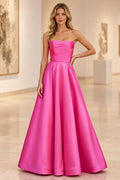 Fuchsia satin A-line prom dress with a strapless straight neckline, softly draped fitted bodice, defined waist, and full pleated skirt.