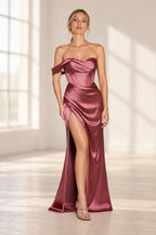 Mauve rose satin prom dress with a draped sweetheart neckline, single off-shoulder sleeve, corset-style bodice, and thigh-high slit.