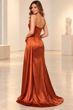 Back view of a rust satin prom dress with adjustable spaghetti straps, a low curved neckline, fitted zipper back, and slight train.