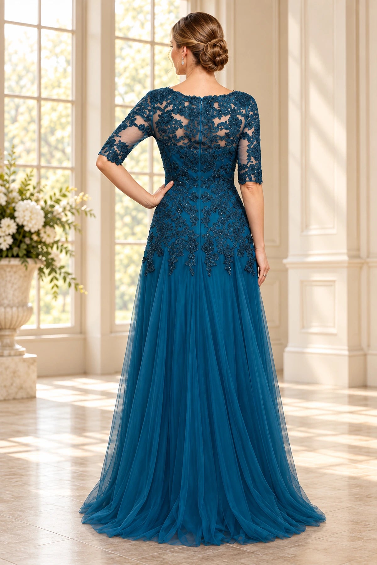 Back view of teal blue Mother of the Bride Dress with sheer floral lace, center zipper and floor-length A-line skirt