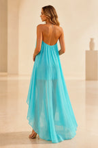 Back view of turquoise wedding guest dress with halter tie, open back and flowing high-low floor-length chiffon skirt