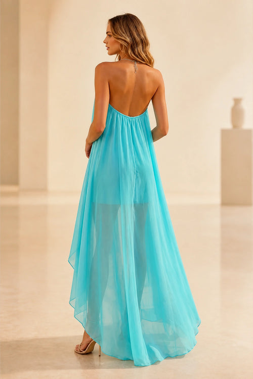 Back view of turquoise wedding guest dress with halter tie, open back and flowing high-low floor-length chiffon skirt