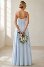 Back view of sky‑blue strapless bridesmaid gown with invisible zipper closure