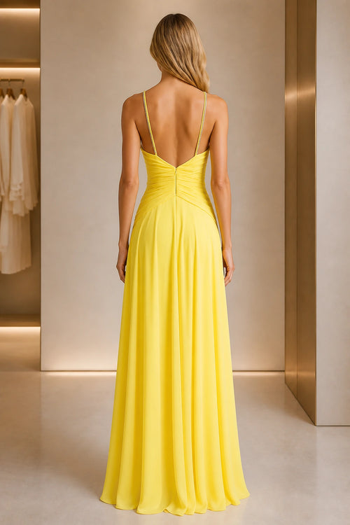 Back view of yellow A-line prom dress with deep V-back and gathered waist