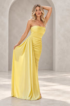 Yellow strapless mermaid prom dress with a ruched bodice, draped waist and floor-length satin-like skirt by Graceprom.