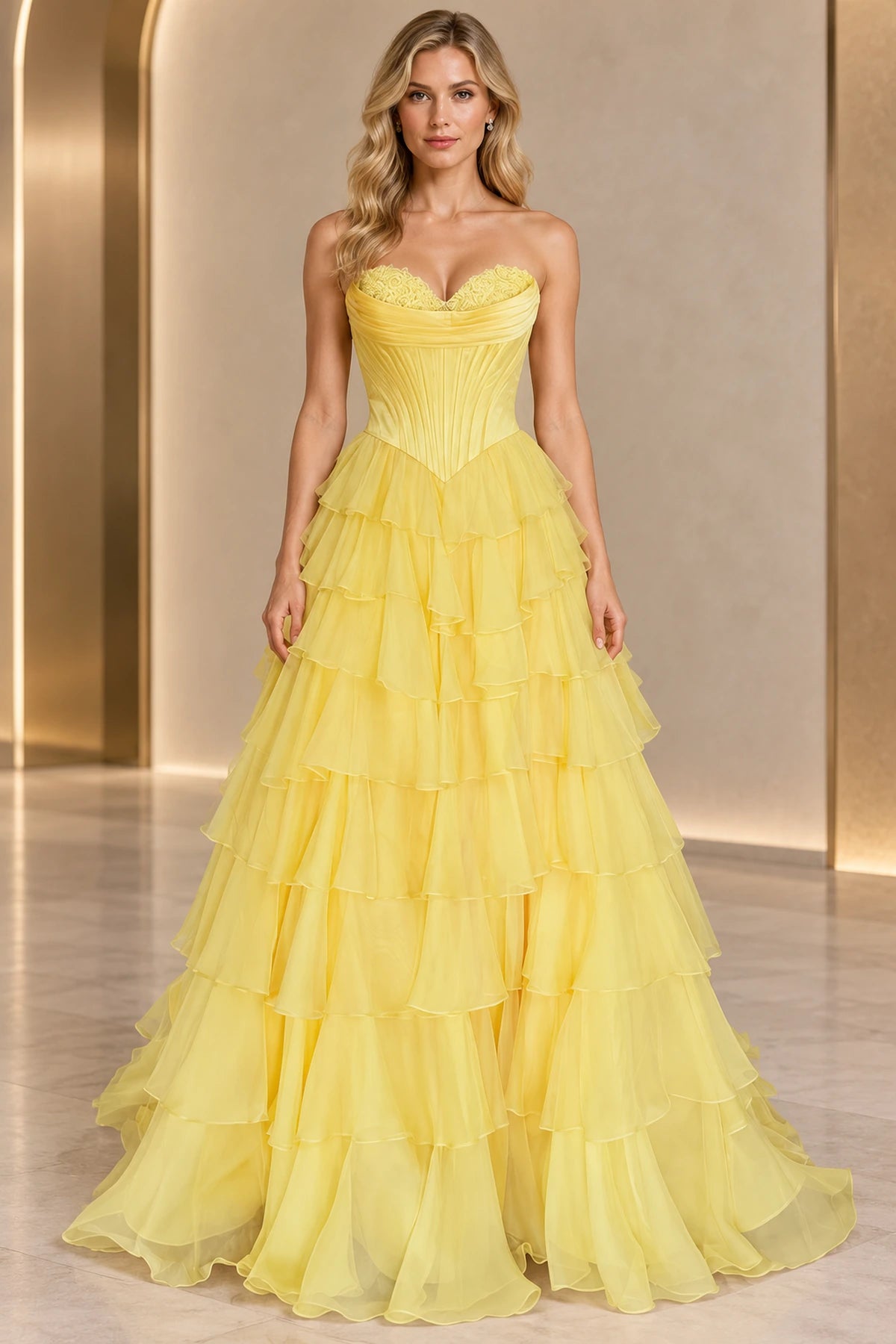 Yellow princess ball gown prom dress with a strapless sweetheart neckline, lace-trimmed pleated corset bodice, pointed waist, and tiered ruffle skirt by Graceprom.