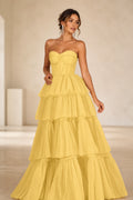 Yellow sweetheart strapless tiered floor-length ball gown prom dress front view