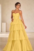 Yellow sweetheart strapless tiered floor-length ball gown prom dress front view