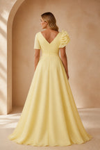 Back view of yellow floor-length prom dress with V-back neckline and zipper closure